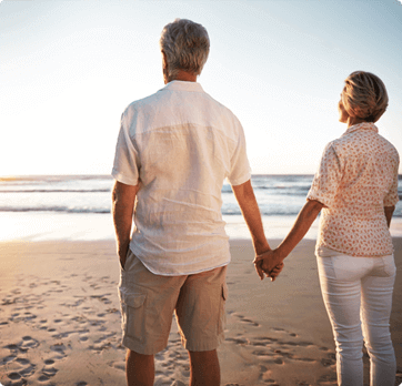 couple holding hands at the beach